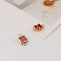 Close-up of golden geometric square connectors with faceted red zircon stones for jewelry - 8*13mm / Red