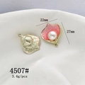 Macro detail of shell-shaped pendants with pink enamel, pearls, and golden textured back - 4507# Pearl Flower