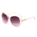Women's pink translucent oval sunglasses with gradient purple lenses and gold bow detail - Pink Frame Smoke Grey Lens