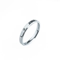 Close-up of a minimalist silver titanium ring featuring a single set round diamond detail - US 6 / 3MM Silver Double Beveled Inlaid