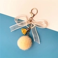 Cute champagne fur ball keychain with white organza bow and yellow tassel on gold hook - Beige