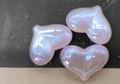 Detailed close-up of pink heart-shaped beads with a glossy iridescent finish for DIY crafts - 16x22mm / Iridescent Purple