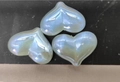 Macro shot of three pearlescent heart-shaped beads for DIY jewelry and phone charms - 16x22mm / Iridescent Blue