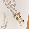 Close-up of faceted crystal beads and gold metal chain with non-slip rubber loop - White with Bowknot