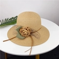Detailed close-up of khaki straw hat with light brown fabric flowers and lace mesh decoration - M (56-58cm) / Khaki