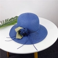 Close-up of dark blue straw sun hat with decorative fabric flower and green ribbon leaf - M (56-58cm) / Navy Blue