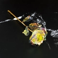 Iridescent 24k gold foil artificial rose with golden stem on black marble background - Rainbow Gold Foil Rose - Multicolor