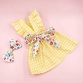 Detail of yellow plaid dog dress with floral bow and matching pet hair accessory - XS / Yellow Plaid With Floral