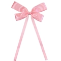 Detail view of a soft pink satin ribbon hair bow with long flowing streamers - Pink