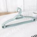 Set of 6 non-slip plastic hangers in Morandi green with shoulder grips and pant bars - Grey Blue