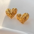 Macro shot of 18k gold plated heart earrings with unique retro lava texture finish - Earrings / Gold