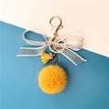 Cute yellow plush pompom keychain with lace bow and golden metal lobster clasp - Ginger Yellow