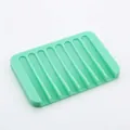 Mint green silicone soap dish with a slotted self-draining design for easy drying - Square / Mint Green