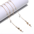 Golden rice pearl glasses chain featuring teardrop pearls and lobster clasps for eyewear - Ellipse Design