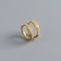 Macro view of gold S925 sterling silver hoop earrings set with shimmering cubic zirconia - 925 Silver / Gold Color (Pair)