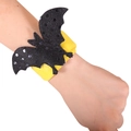 Halloween snap bracelet with a yellow sequined black bat decoration on a wrist - Black Bat