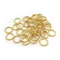 Close-up of golden open jump rings for DIY jewelry making and connector projects - Single Ring-4x0.7mm / Gold