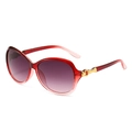 Fashion oval sunglasses with red-pink gradient frames and gold metal heart detail - Gradient Red Frame Gradient Grey Lens