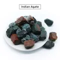 Natural raw Indian Agate stones in diverse colors displayed on a white round ceramic plate - India Agate