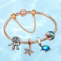 Rose gold ocean charm bracelet featuring sea turtle and starfish pendants on blue water background - 18cm / Style C/Rose Gold Starfish Dreamcatcher