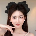 Große schwarze Haarklammer mit Perlen-Schleife für ein elegantes und minimalistisches Styling - Schwarz Perle Schleife Federclip