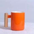 Nordic minimalist orange ceramic coffee mug with a natural wooden handle - Cylindrical Orange Mug
