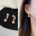 Macro detail of gold-plated champagne pearl clip-on earrings with micro-set zircon - Champagne Pearl Clip-on