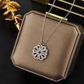 Silver four-leaf clover necklace with sparkling crystals on a brown jewelry gift box - Silver