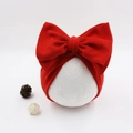 Detail of red oversized bow baby headband crafted from soft cashmere-like material - Red