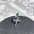 Detailed shot of silver snake ring with green teardrop gem and realistic scale texture - Style 9 Adjustable Ring