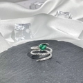 Detailed macro of a silver snake ring with green pear-shaped gemstone and scale texture - Style 13 Adjustable Ring