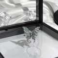 Detail of butterfly ring with blue enamel wings and gemstone on silk background - Silver Blue Green Gradient Enamel Butterfly Style (13)
