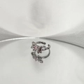 Macro shot of silver bow ring with pink zircon gemstone reflecting on a mirror - Silver Bowknot Pink Zirconia Style (2# Open Ring)