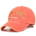 Close-up of orange washed cotton baseball cap with 3D New York embroidery detail - M / Orange