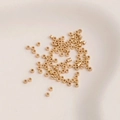 14K gold plated cylindrical spacer beads for DIY jewelry making on beige ceramic - Mini Tube Beads 1.6mm [100Pcs]