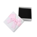 Textured white jewelry box with a pink satin bow and black velvet interior lining - Tote Bag / Pink