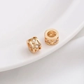 Macro shot of 14K gold plated lattice spacer beads with micro-set cubic zirconia accents - Style 13 / 8x5mm / 14K Gold