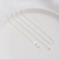 Detailed view of silver bead chain necklace with lobster clasp and teardrop extension - Satellite Bead Chain / Thick Silver Plated