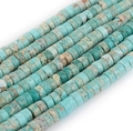 Detail of turquoise colored flat spacer beads with natural brown mineral texture - Light Turquoise