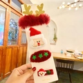 Set de 4 clips para el pelo navideños con astas de reno de felpa y motivos de Papá Noel - Juego de Papá Noel