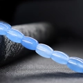 Macro shot of blue barrel-shaped natural jade beads for DIY jewelry making and crafts - Aquamarine