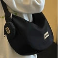 Black nylon dumpling crossbody bag with wide shoulder strap and matching small round coin purse - 24cm x 21cm x 11cm / Black