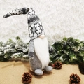 Nordic Christmas Gnome figurine with gray knitted snowflake hat on a rustic wooden base - Gray