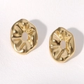 Macro detail of gold irregular wavy earrings with a polished metallic texture finish - Gold