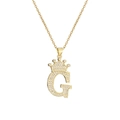 Macro detail of gold-plated crown initial G pendant necklace with sparkling zircons - Crown Letter G(G)