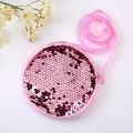 Pink round sequin crossbody bag for girls with strap and floral prop on white background - Pink