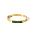 Close-up of 18k gold plated stainless steel bangle featuring emerald green zircon stones - Gold + Green Zircon