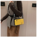 Close-up of yellow mini suitcase crossbody bag with Young lettered strap and stripe detail - Yellow