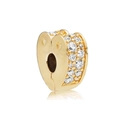 Macro shot of gold heart charm with clear cubic zirconia stones and hollow accents - Gold