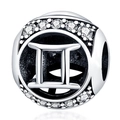 Macro view of silver Gemini zodiac charm with sparkling white crystals for DIY bracelets - Gemini